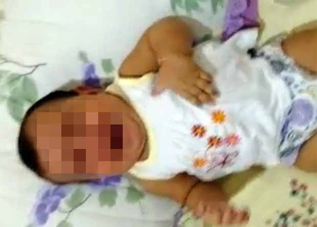 Mãe tenta sufocar bebê de seis meses. (Foto: Divulgação/Polícia Civil)